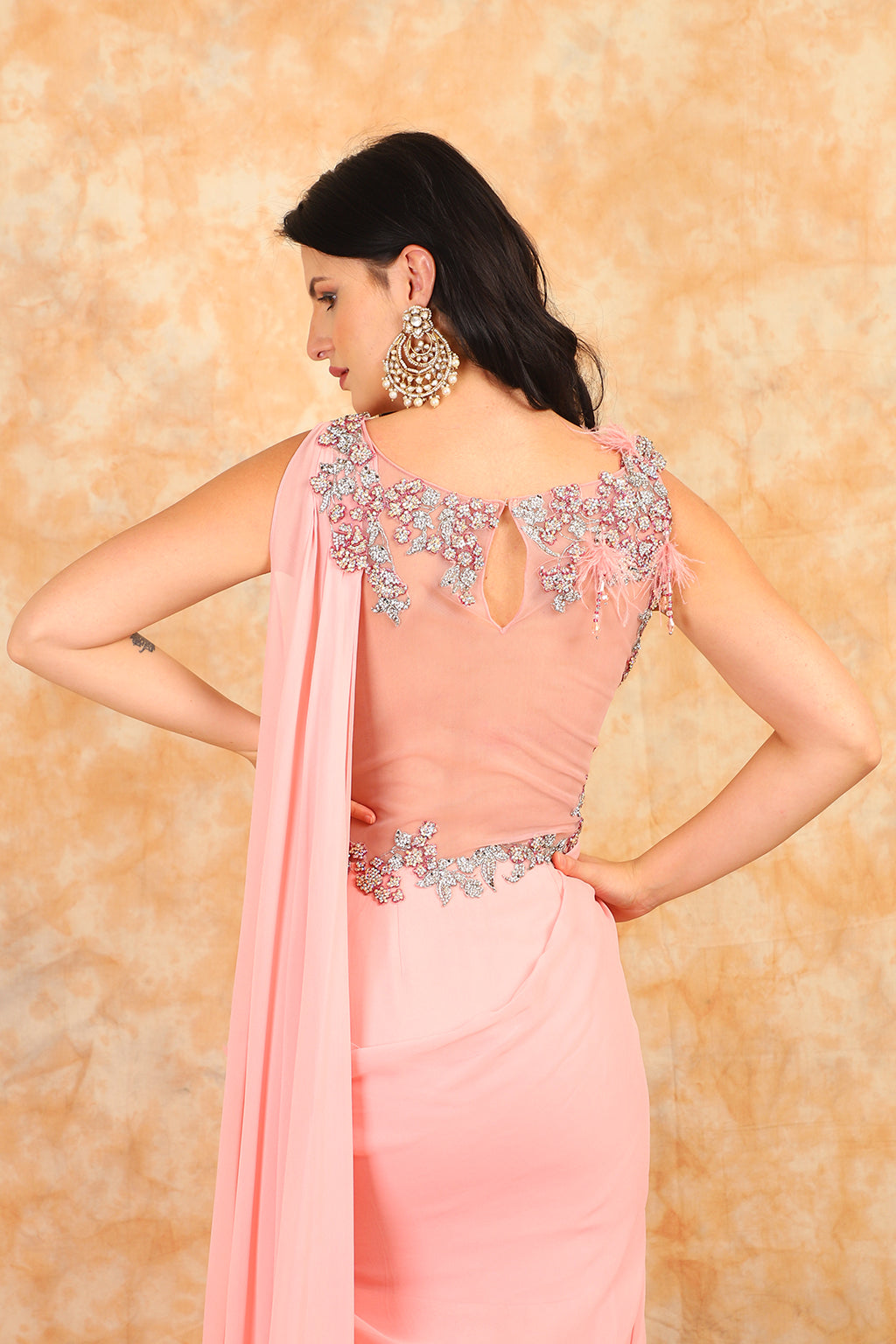 Featuring embroidered blouse with Drape Saree.