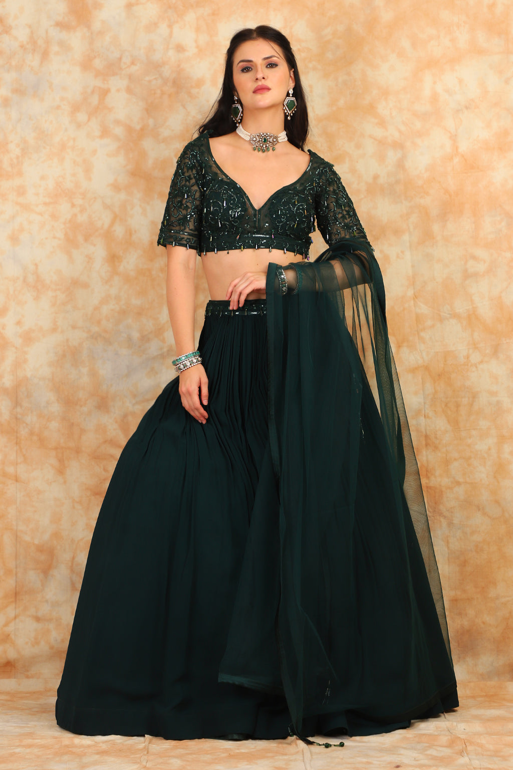 Embroidered bottle green top with georgette skirt
