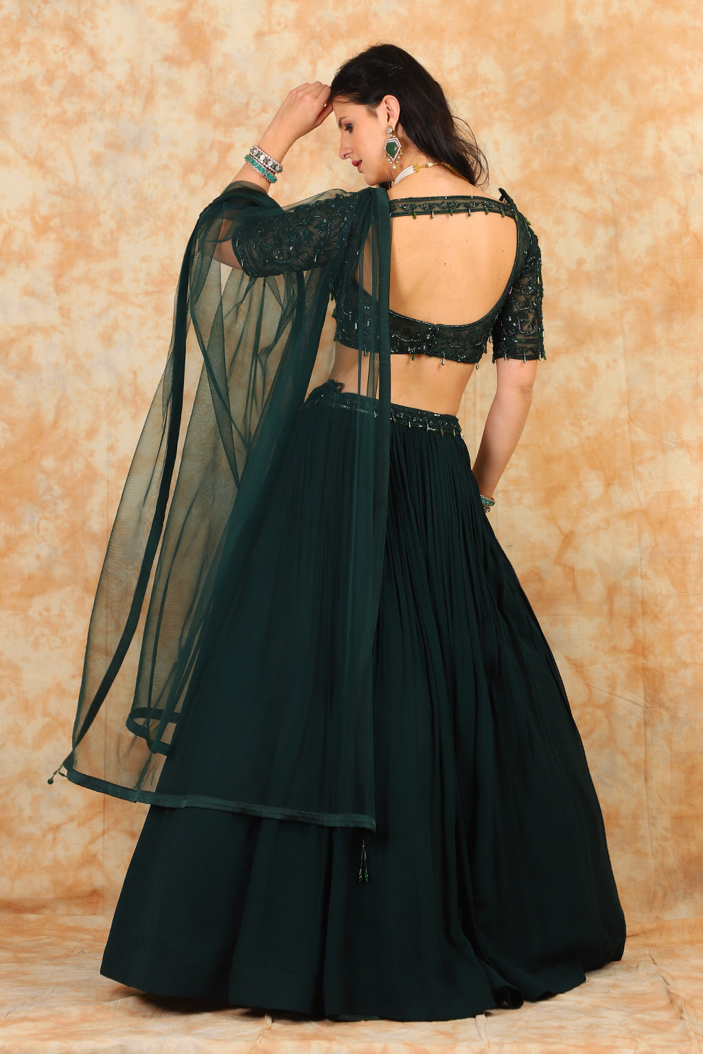 Embroidered bottle green top with georgette skirt