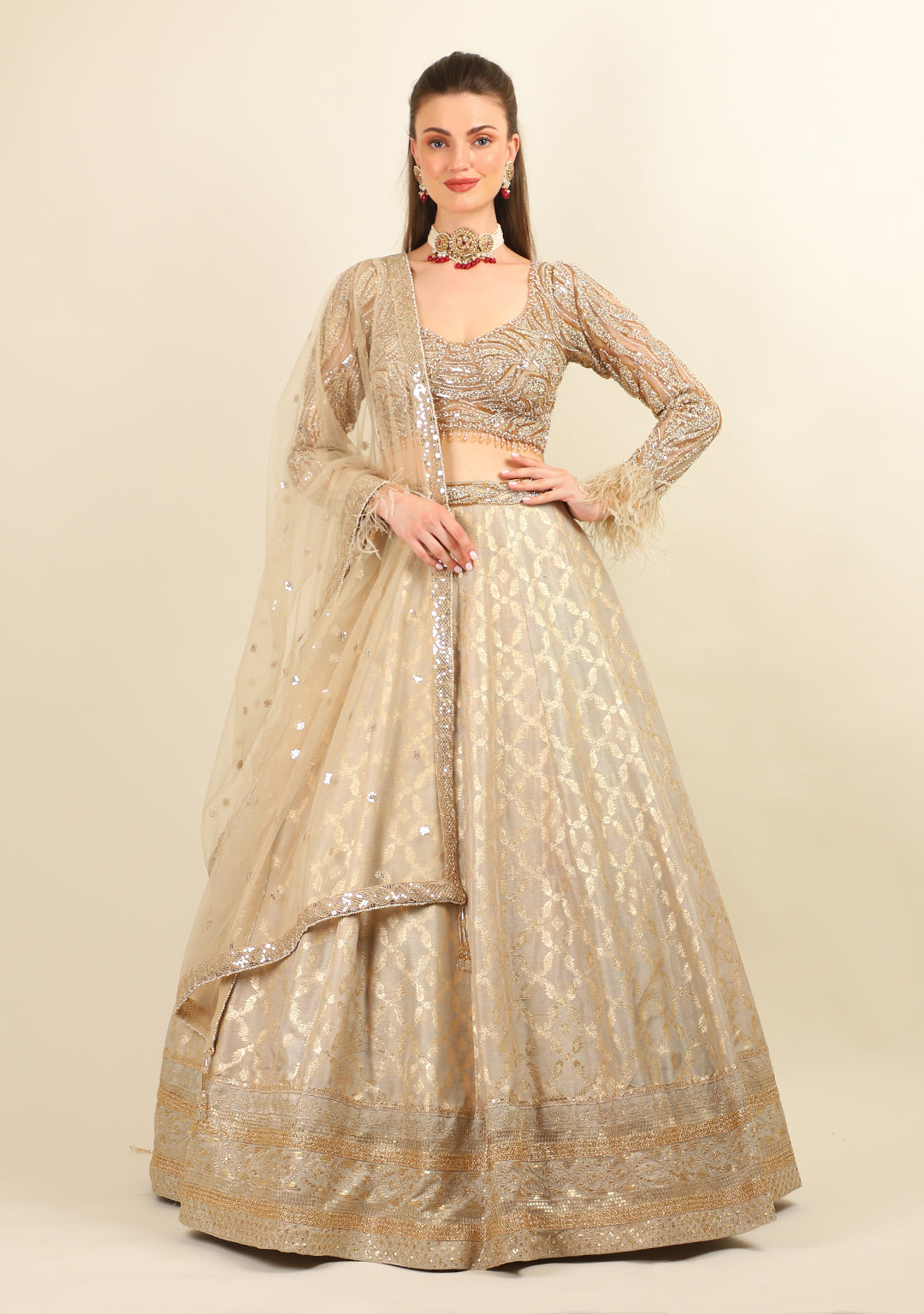 GOLD EMBROIDERED TOP WITH LEHENGA. IT'S PAIRED WITH SCARF.