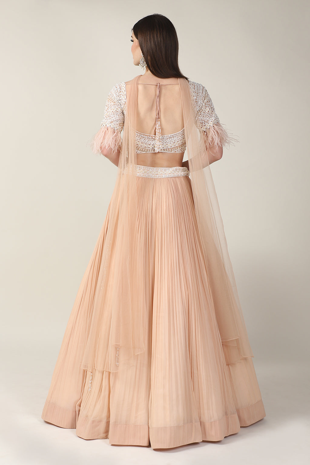 PEACH EMB TOP, FEATHER ON SLEEVE WITH RUSSING SKIRT