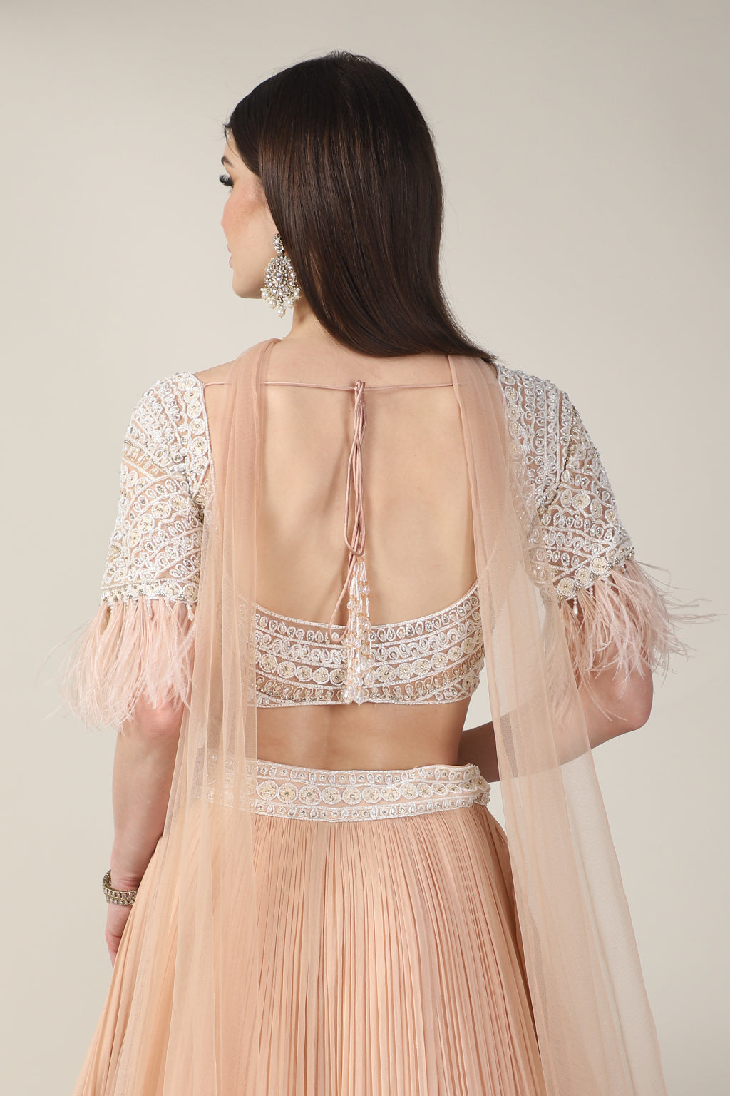 PEACH EMB TOP, FEATHER ON SLEEVE WITH RUSSING SKIRT