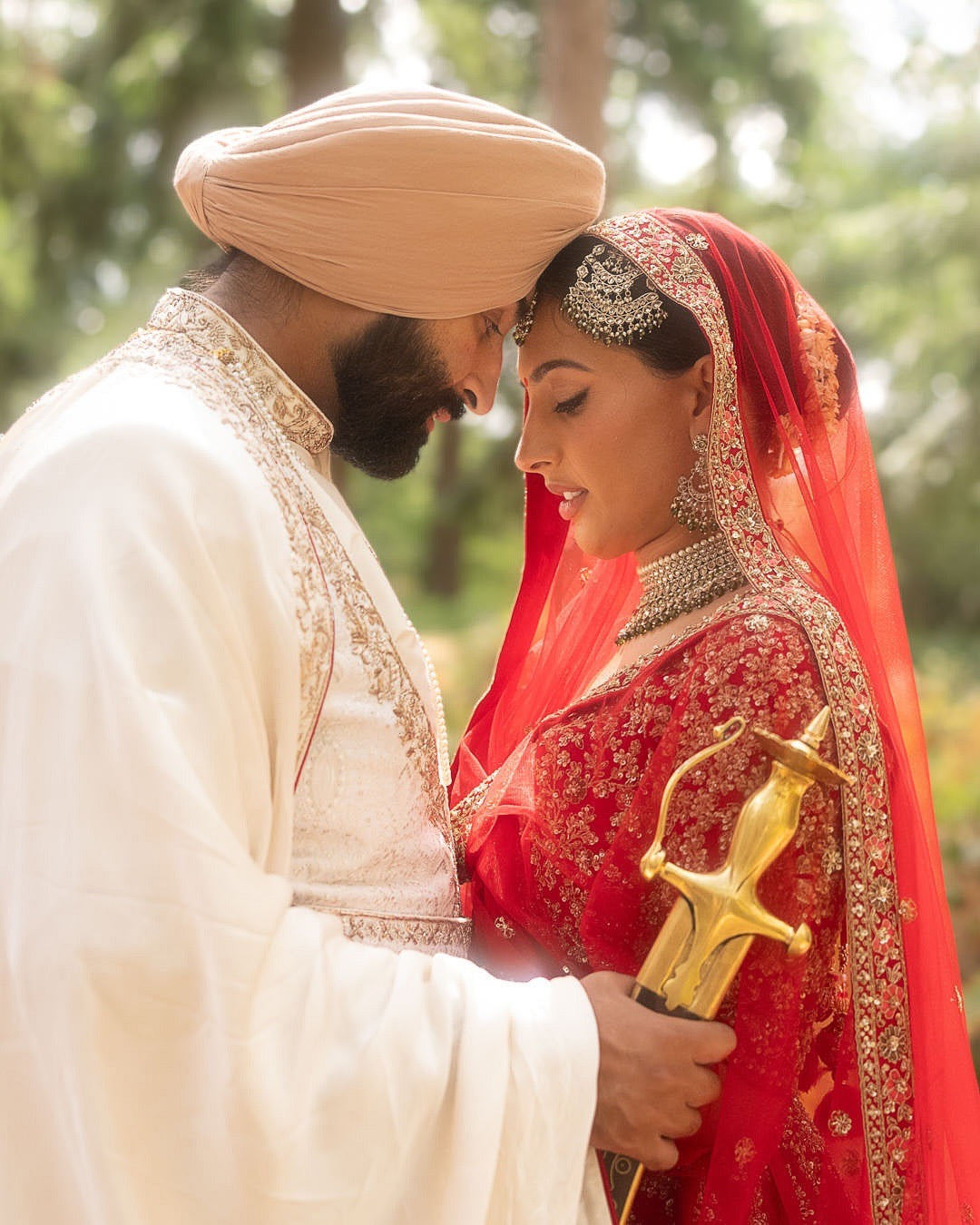 Kajal & Saroop in Regal Red-Ivory Wedding Attire