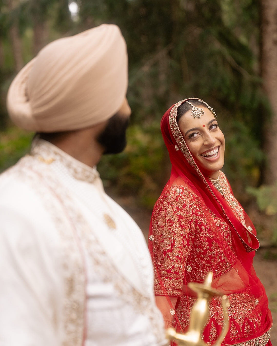 Kajal & Saroop in Regal Red-Ivory Wedding Attire