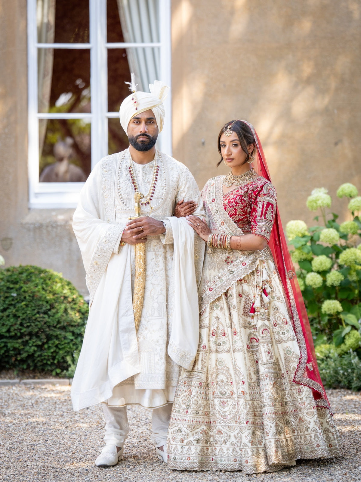 Lakshmi & Sanath in Heritage Ivory-Red Wedding Attire