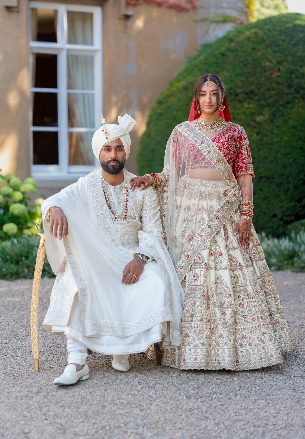 Lakshmi & Sanath in Heritage Ivory-Red Wedding Attire