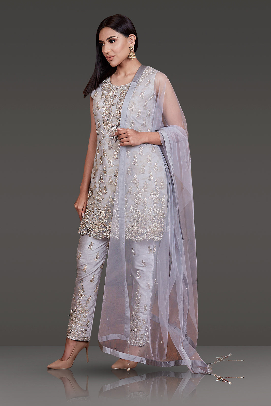 LIGHT GREY KAMEEZ WITH ZARI AND STONE WORK ALL OVER PAIRED WITH SILK PANTS AND NET DUPATTA