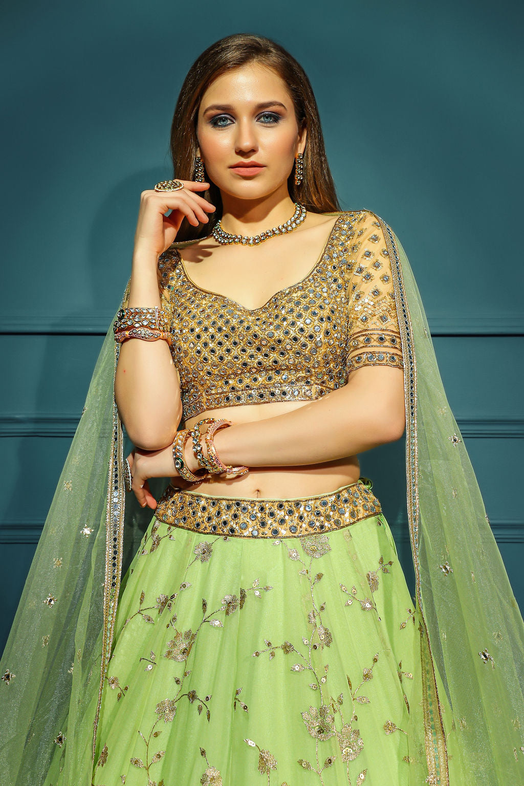 Golden blouse with green skirt