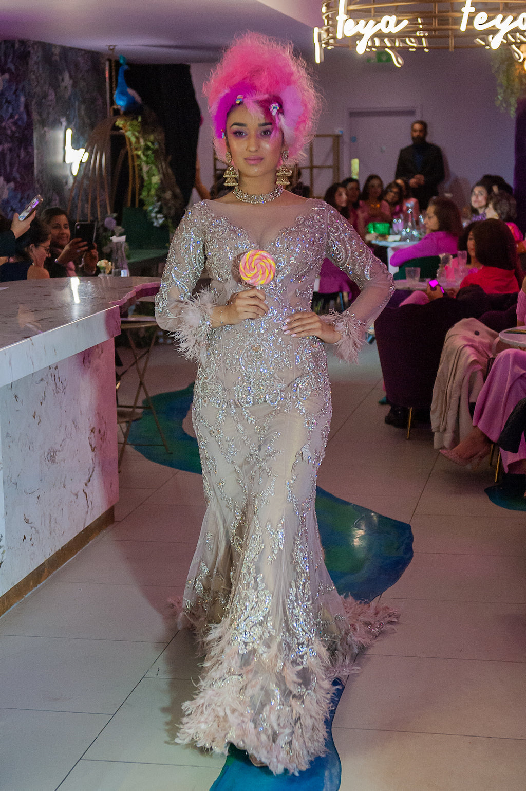 Nude hand mebroidered gown with feathers