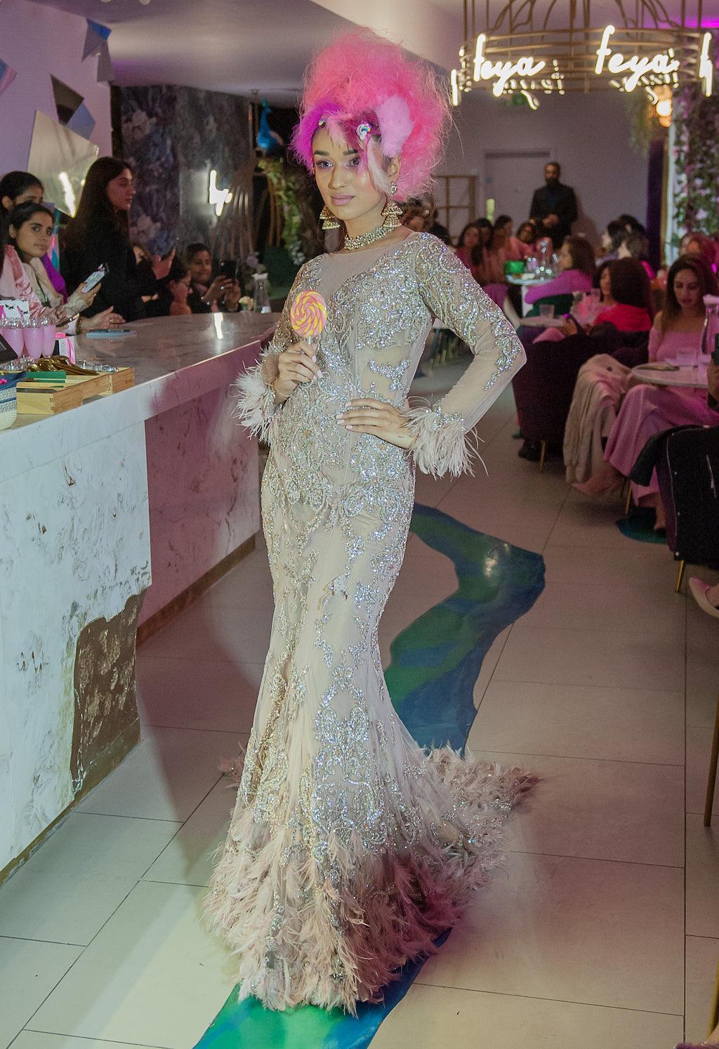 Nude hand mebroidered gown with feathers