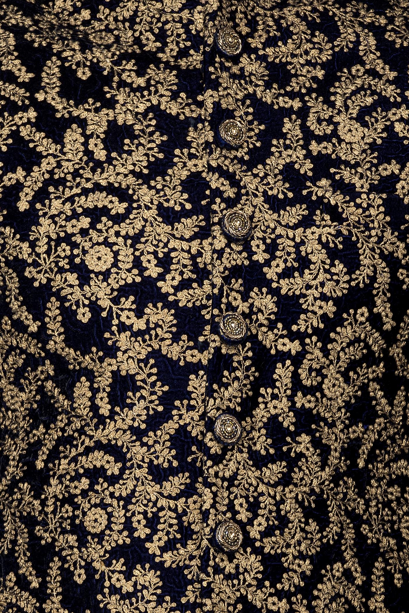 Navy Blue Velvet Sherwani Covered With Gold Zari Embroidery Paired With Gold Chudidar
