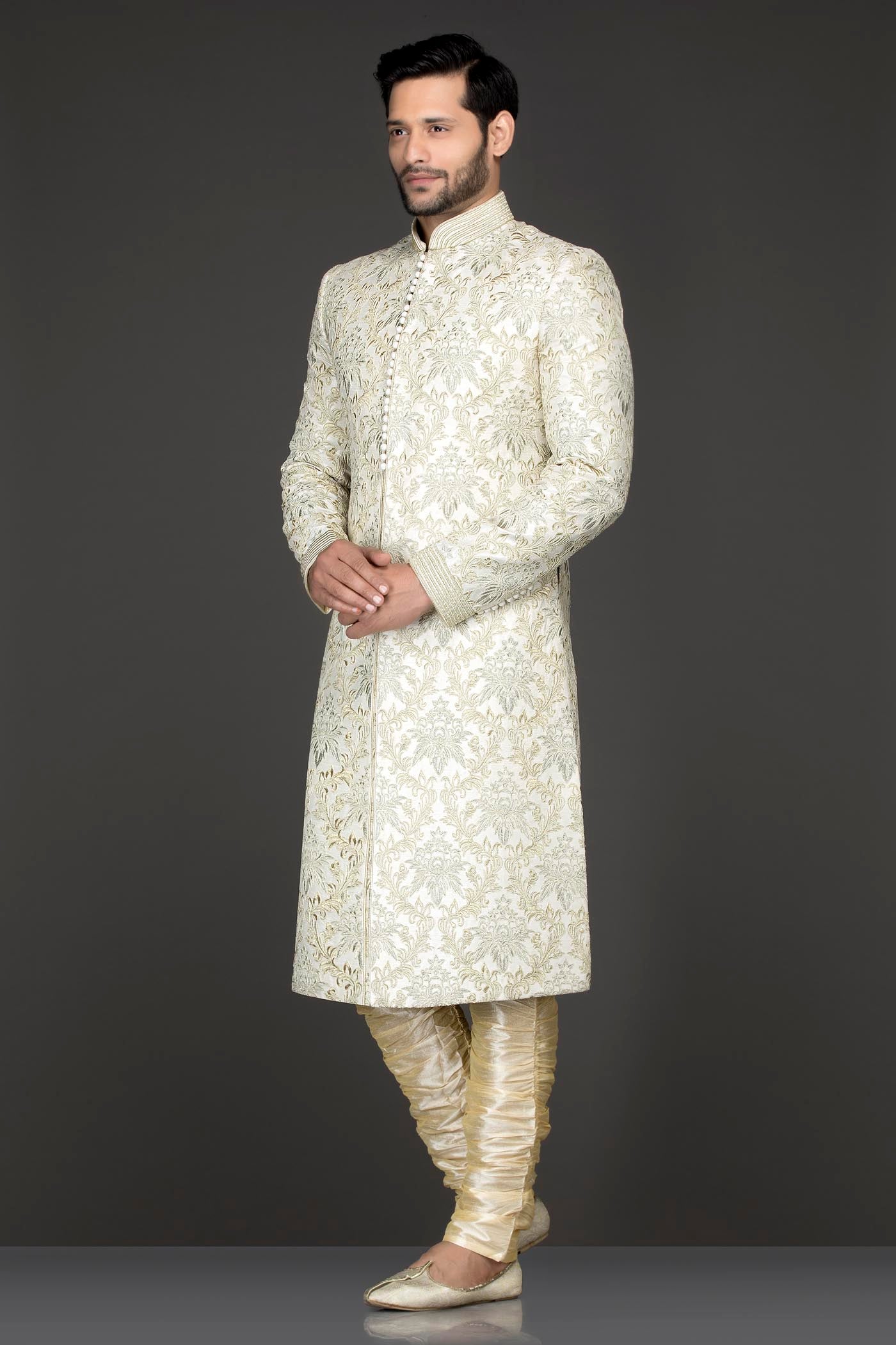 Ivory Colour Silk Sherwani With Silver Zari And Dori Embroidery Paired With Gold Bottoms