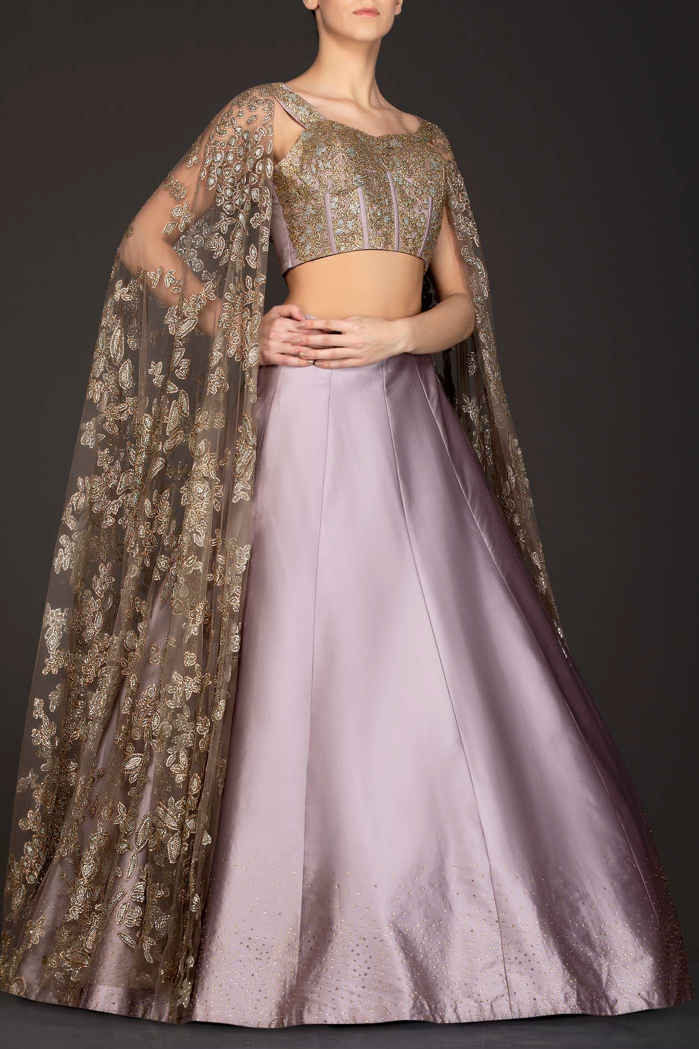 Mauve Colour Silk Skirt With Heavily Embriodered Net Top And Attached Net Cape