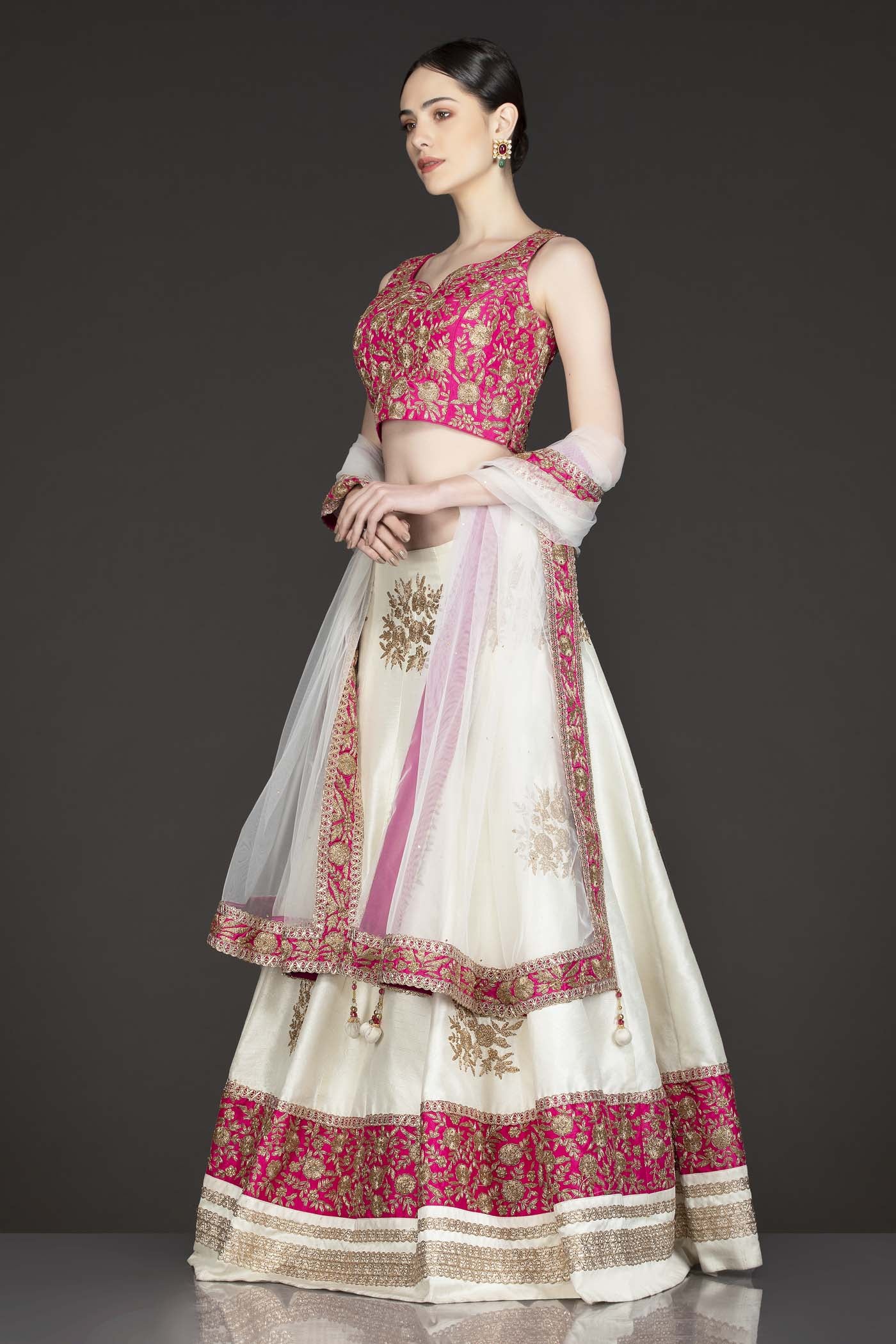 Fuchsia Pink Silk Top With Ivory Silk Lehenga With Net Dupatta
