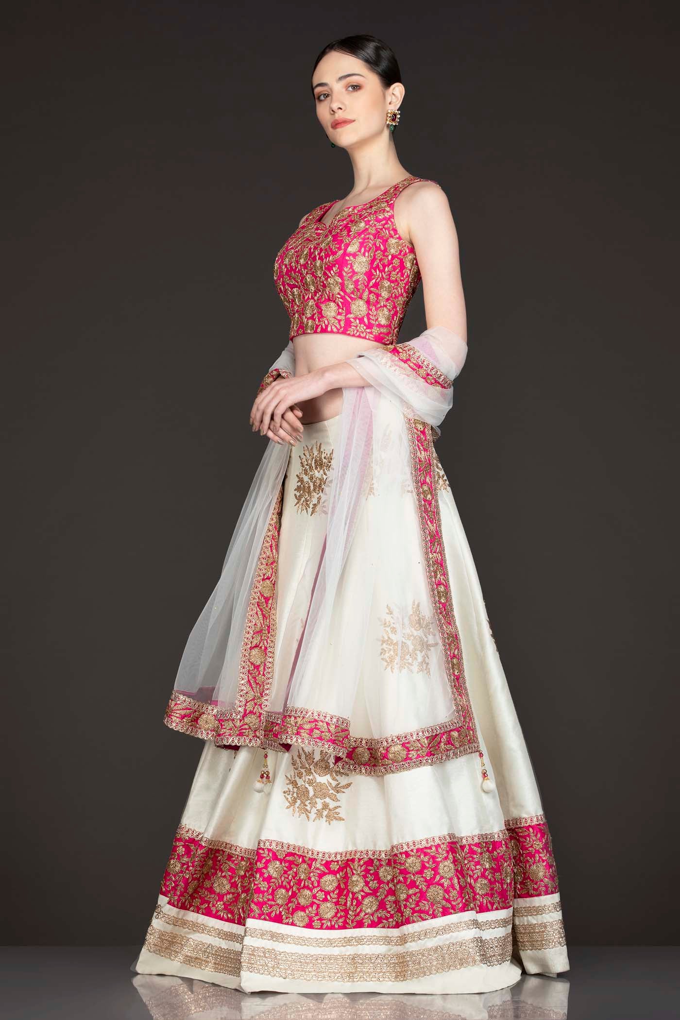 Fuchsia Pink Silk Top With Ivory Silk Lehenga With Net Dupatta