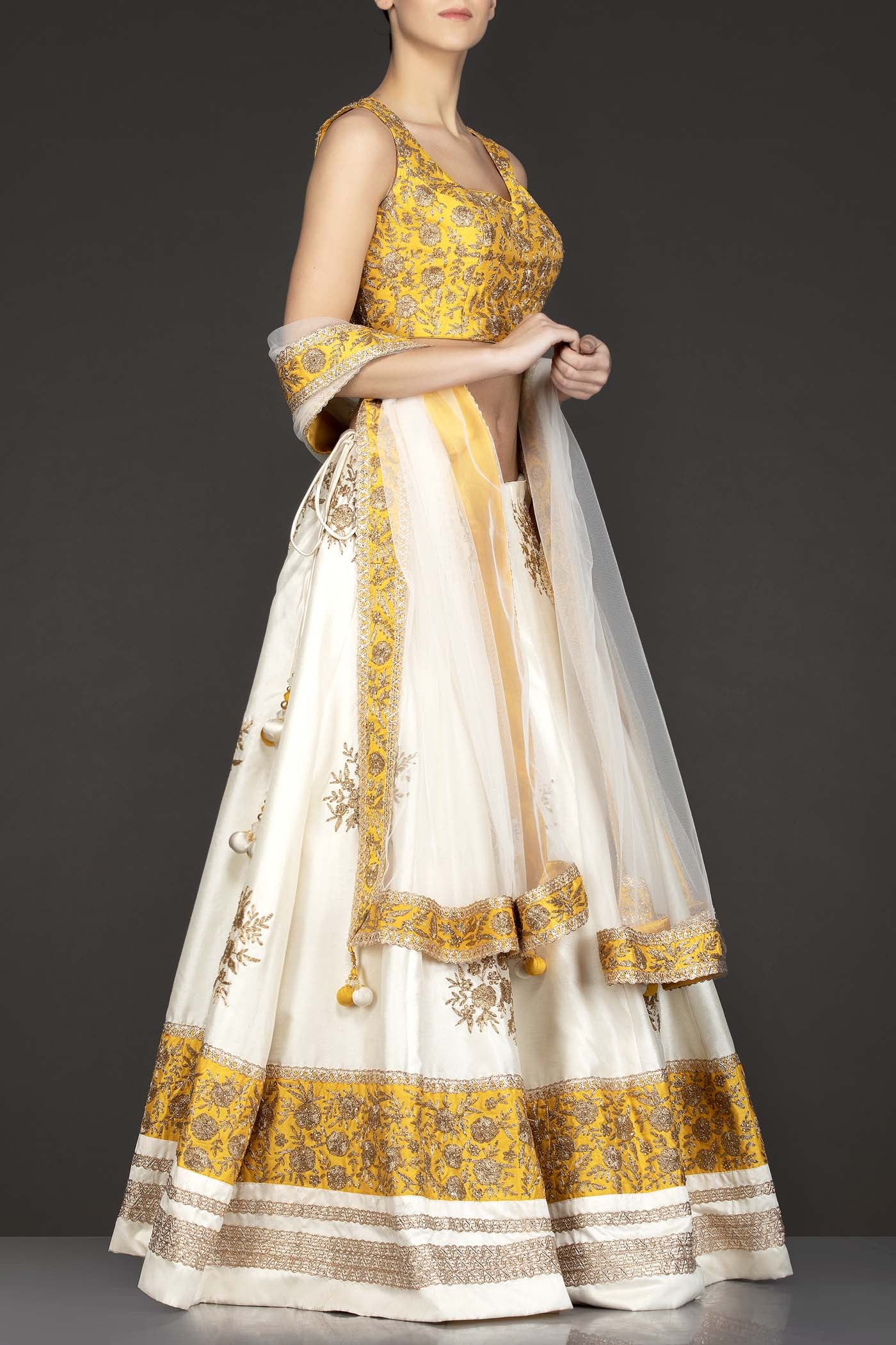 Yellow Silk Top With Ivory Silk Lehenga With Net Dupatta