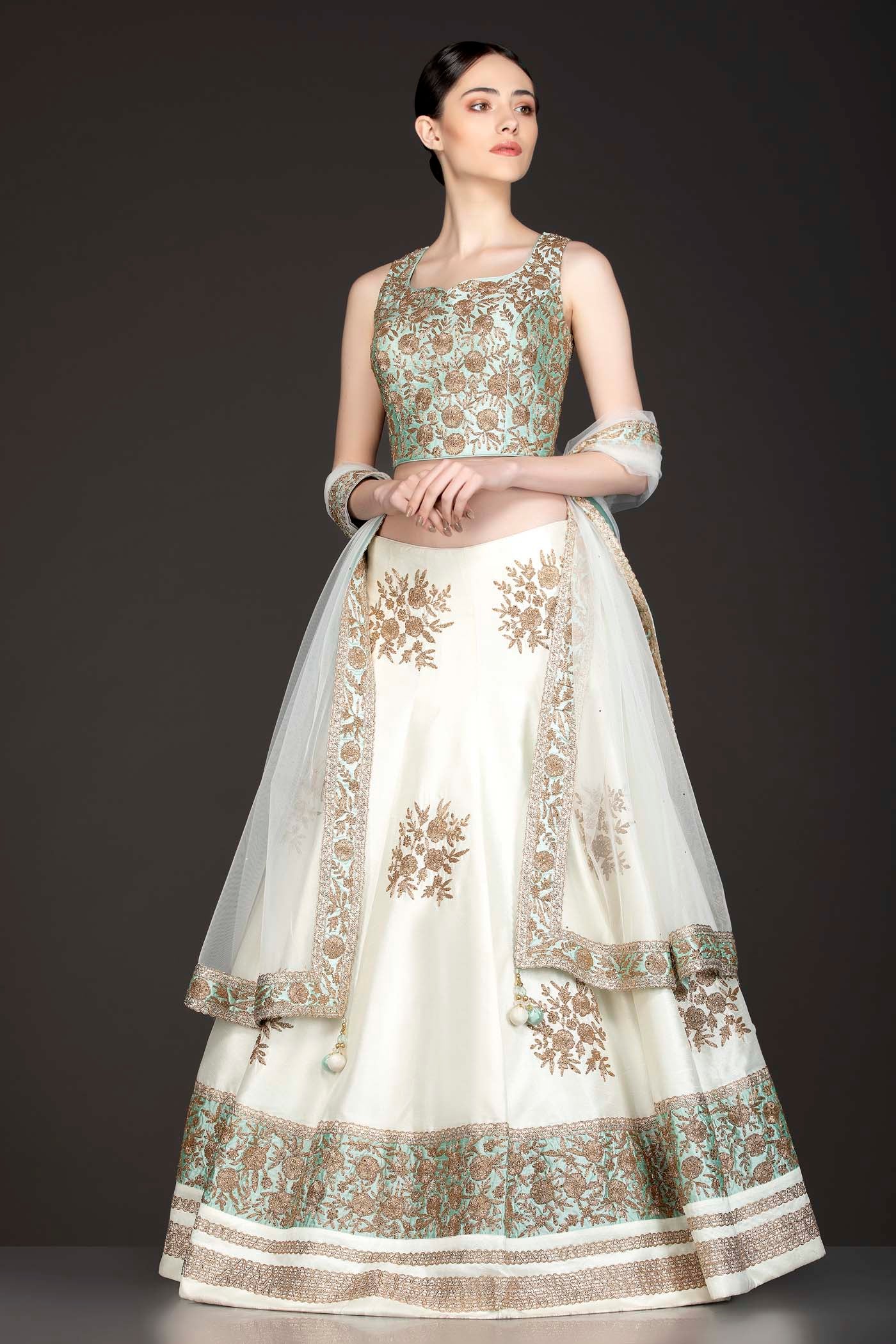 Mint Green Silk Top With Ivory Silk Lehenga With Net Dupatta