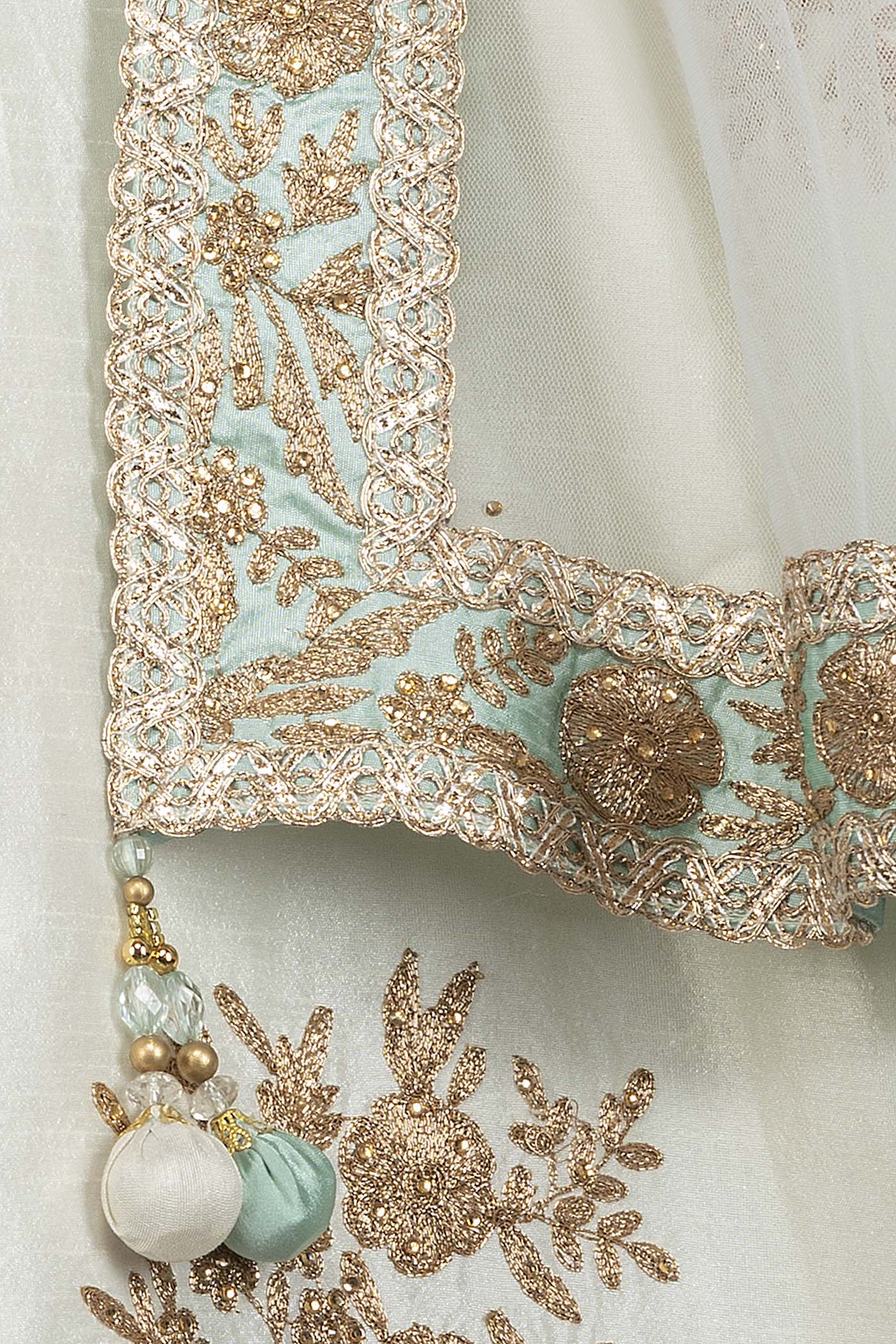 Mint Green Silk Top With Ivory Silk Lehenga With Net Dupatta