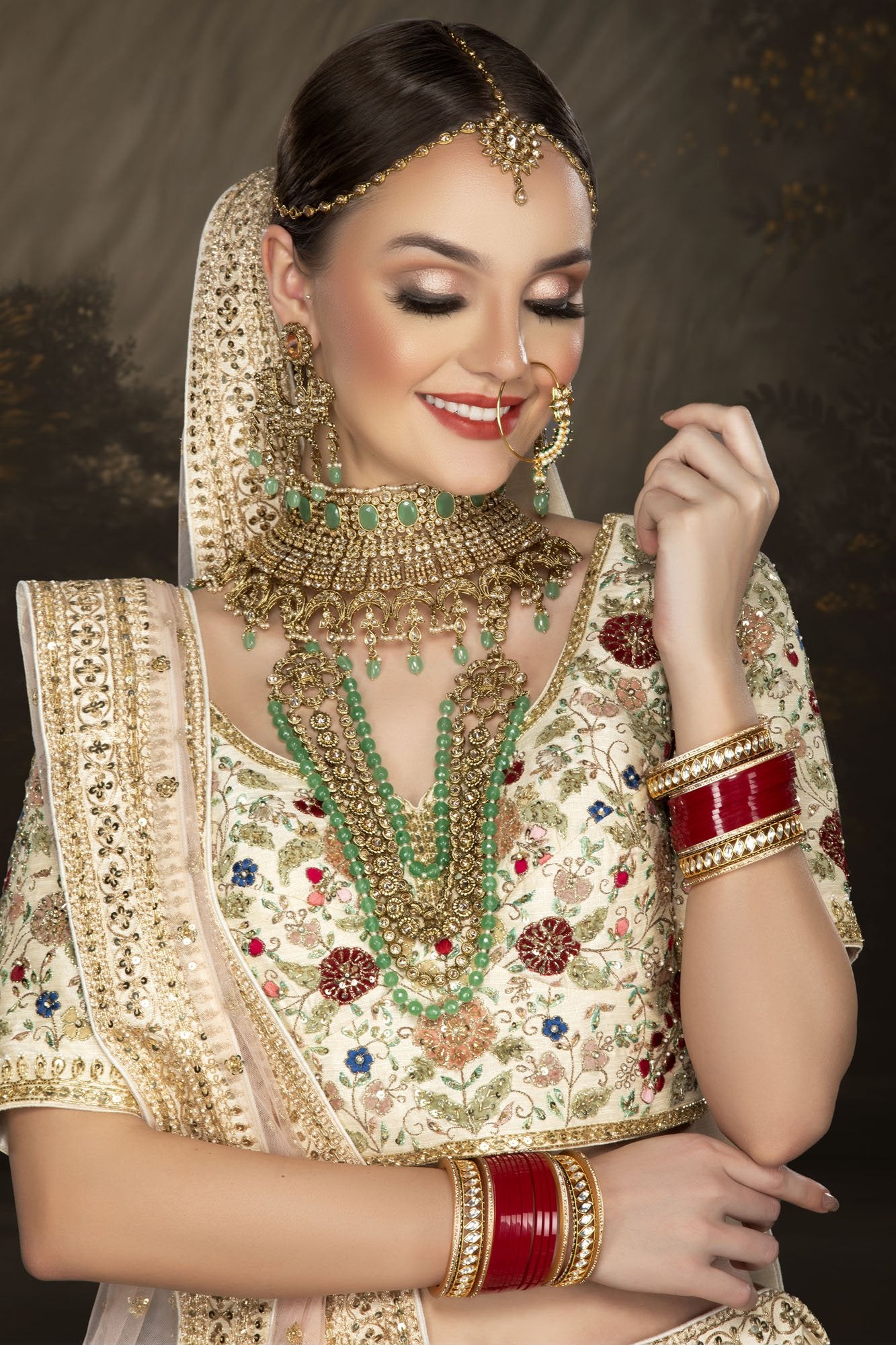 Multi-thread Embroidered Ivory bridal lehenga choli