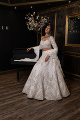 Ivory Lehenga is embroidered with embroidered Top