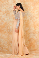 Featuring embroidered blouse with Beige Drape Saree.