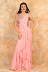 Featuring embroidered blouse with Drape Saree.