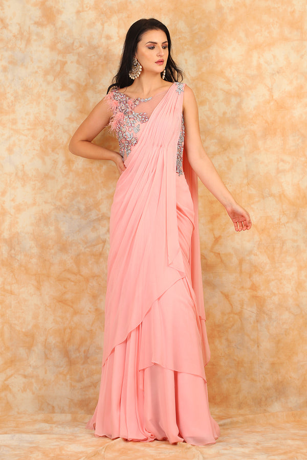 Featuring embroidered blouse with Drape Saree.