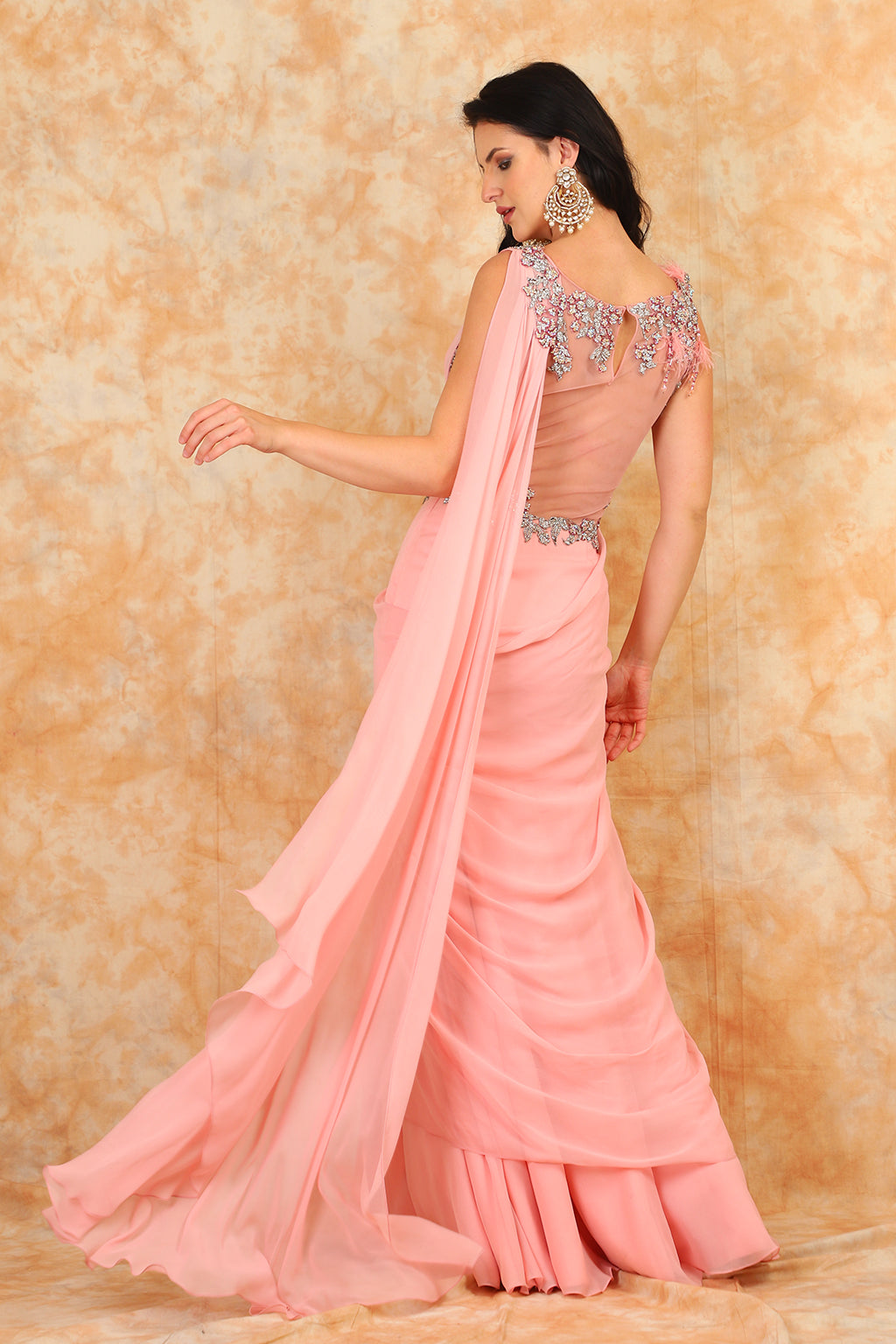 Featuring embroidered blouse with Drape Saree.