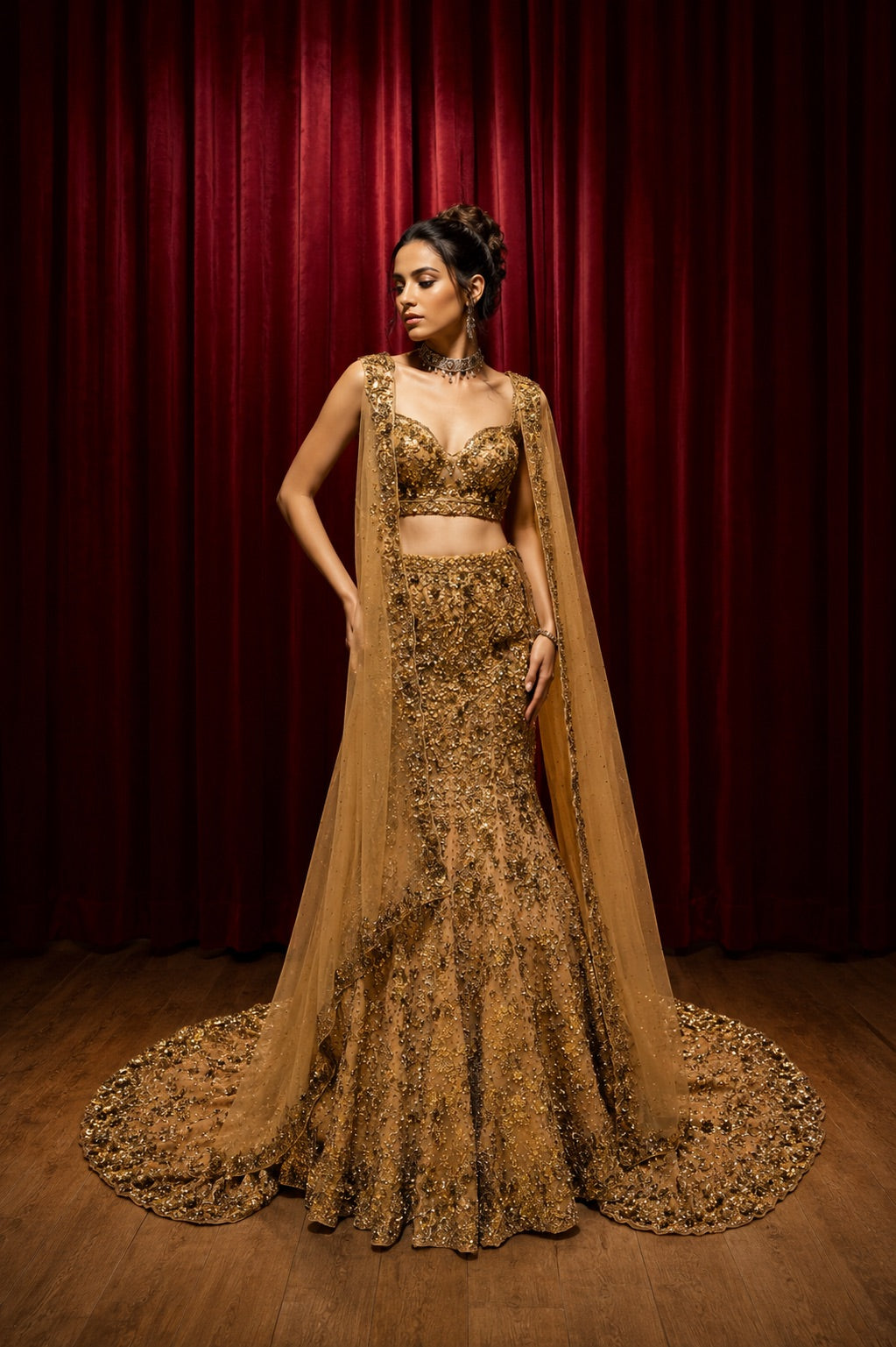 Gold Sequin Embellished Flared Trail Lehenga Set paired with dupatta