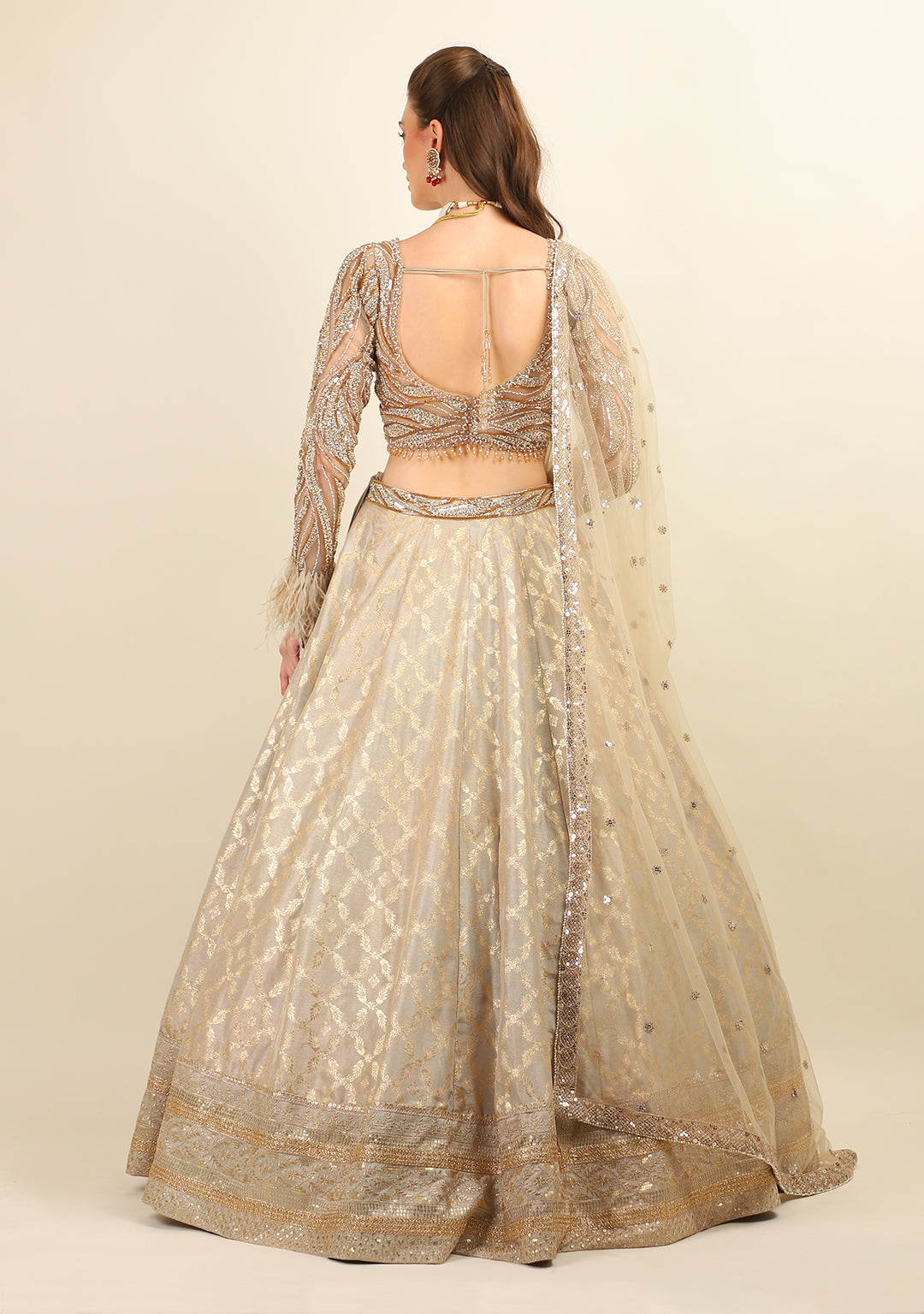 GOLD EMBROIDERED TOP WITH LEHENGA. IT'S PAIRED WITH SCARF.