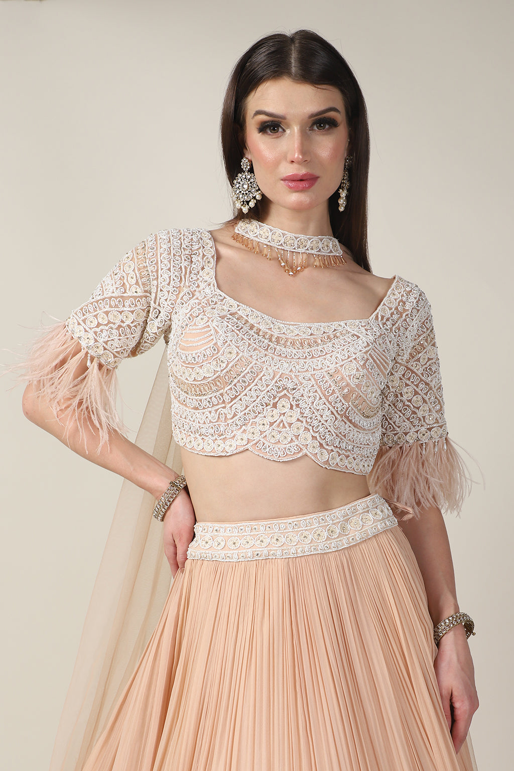 PEACH EMB TOP, FEATHER ON SLEEVE WITH RUSSING SKIRT