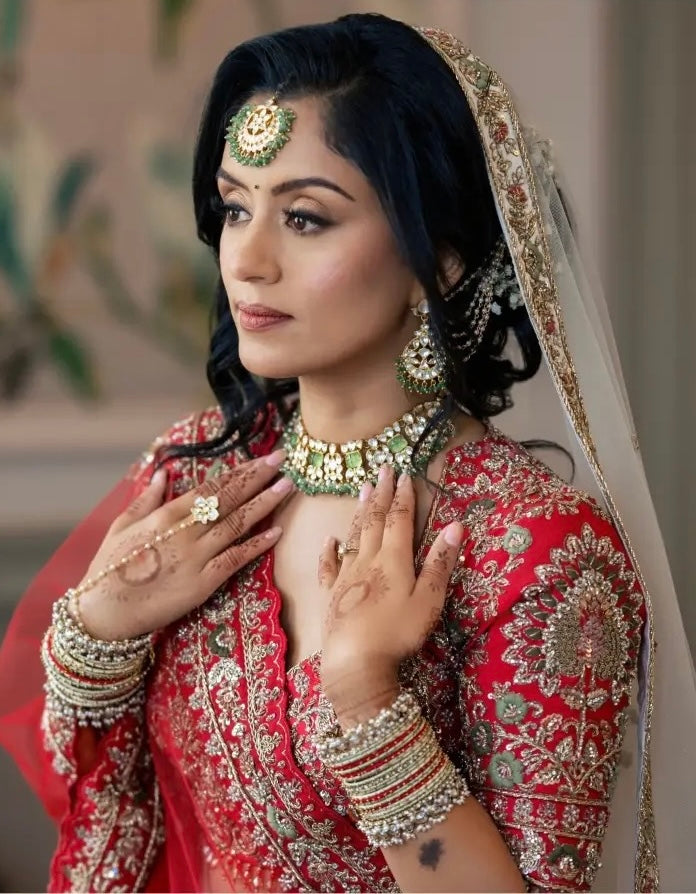 Asha & Pritesh in Ivory & Red Wedding Attire