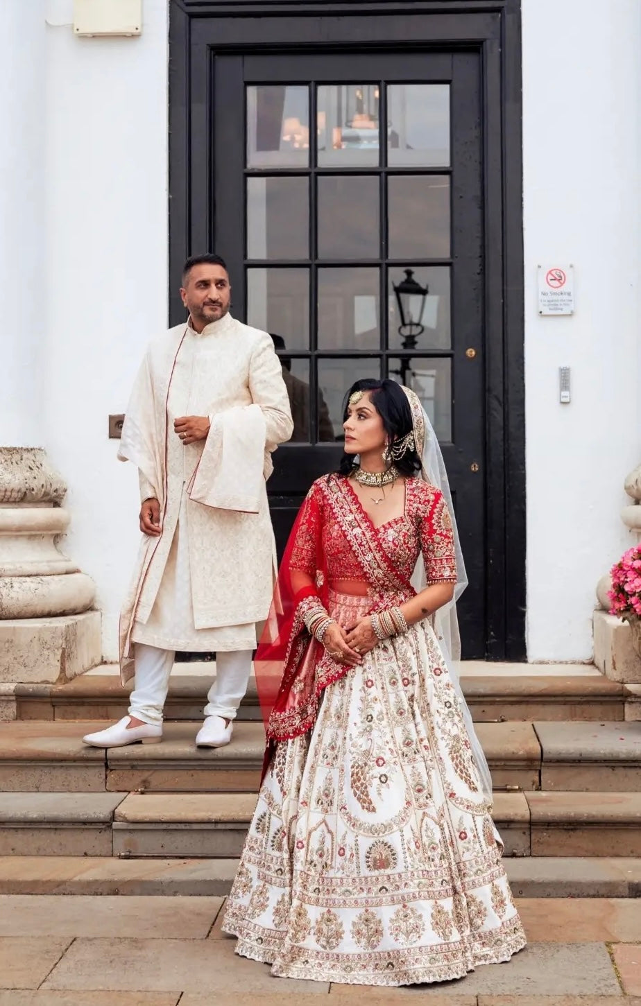 Asha & Pritesh in Ivory & Red Wedding Attire