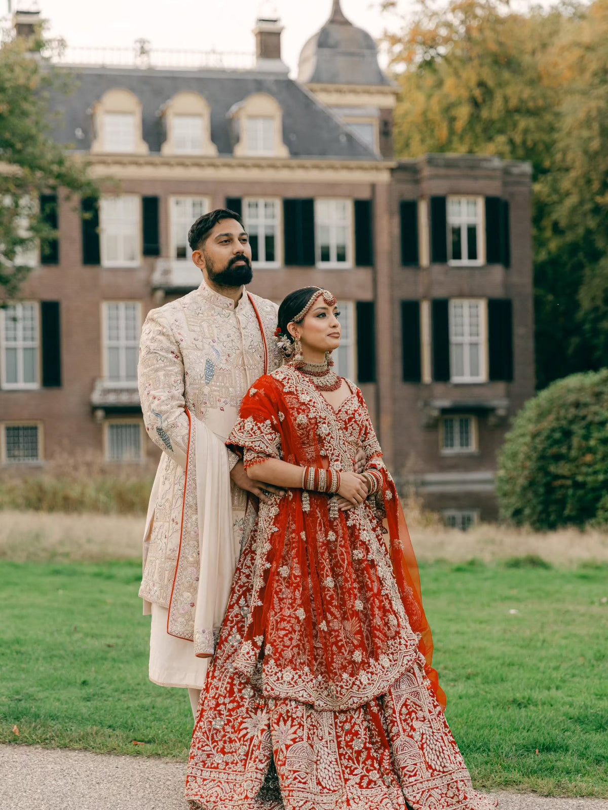 Manesha & Adesh in Red Zardozi & Ivory Wedding Attire