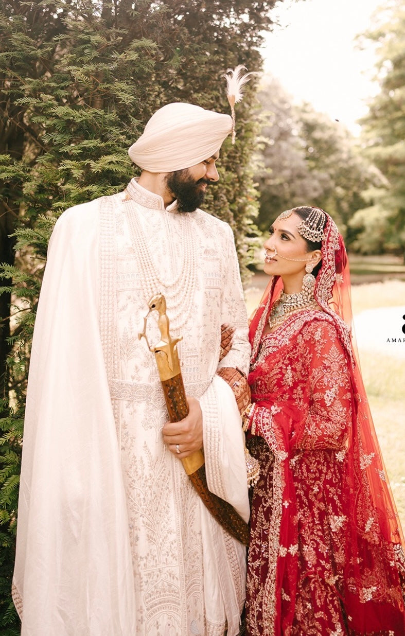 Bride Aman in Maroon Gold Embroidered Lehenga