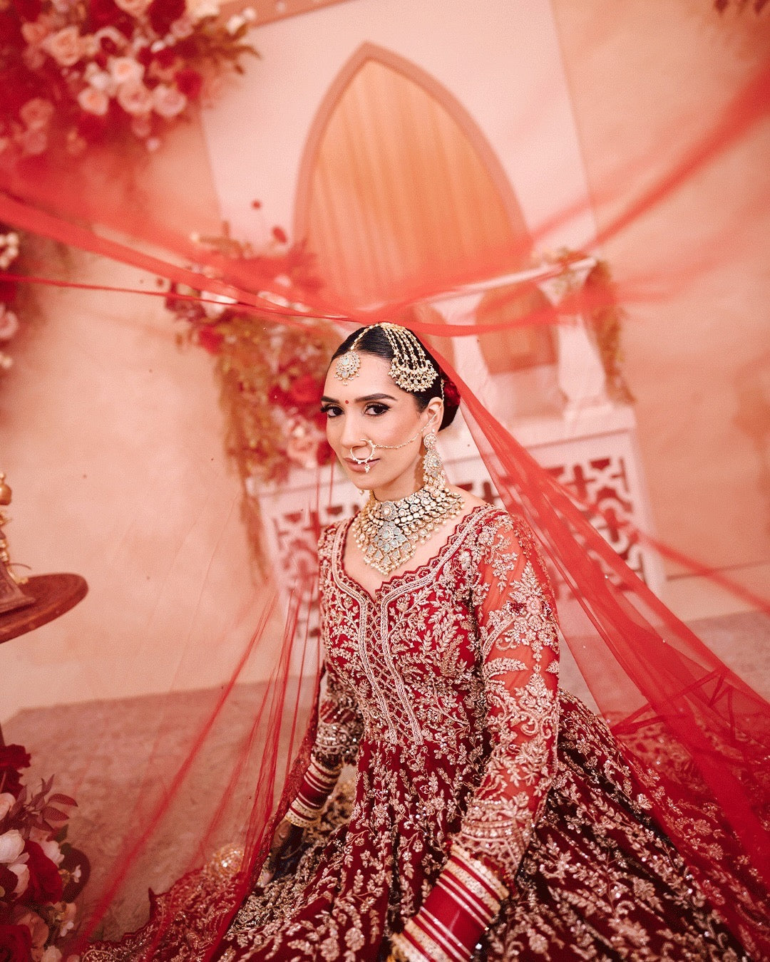 Bride Aman in Maroon Gold Embroidered Lehenga