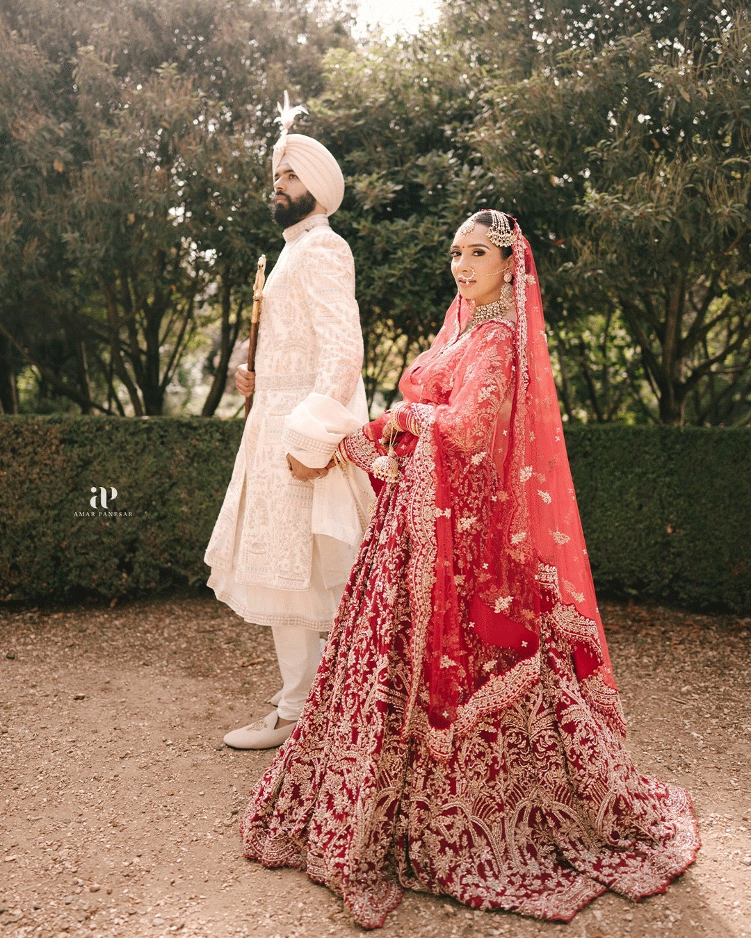Bride Aman in Maroon Gold Embroidered Lehenga