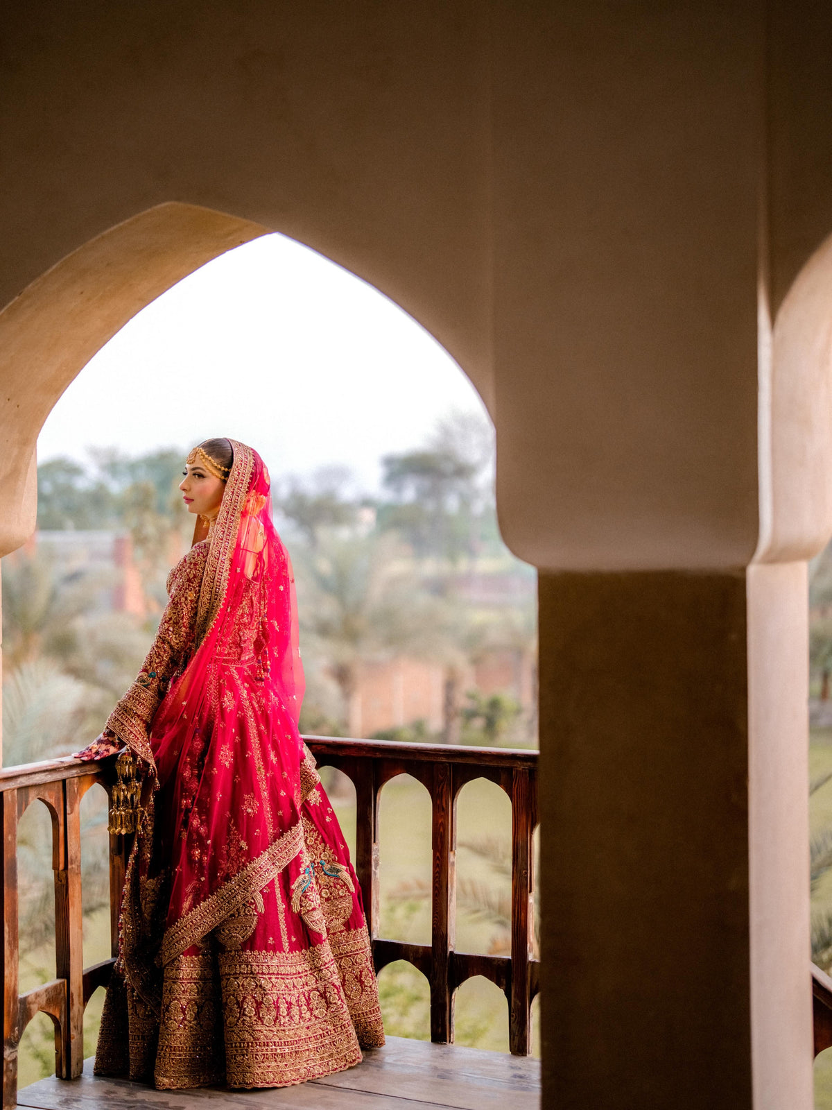 Anam in Ruby Maroon Bridal Lehenga