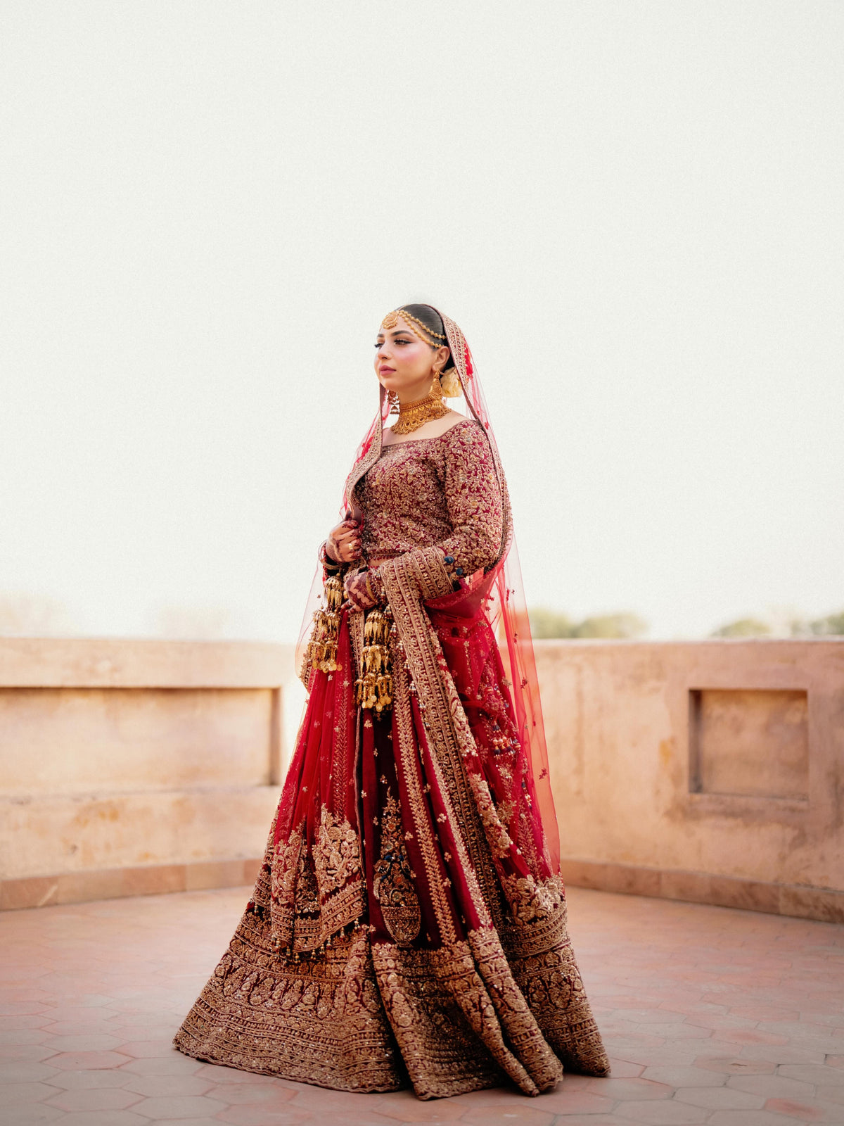 Anam in Ruby Maroon Bridal Lehenga