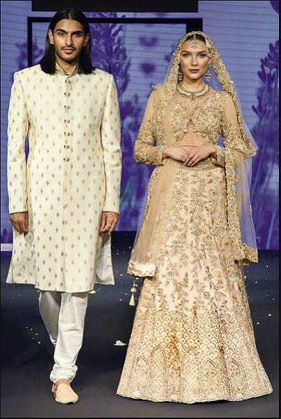 Heavy Golden Bridal lehenga and Ivory Sherwani