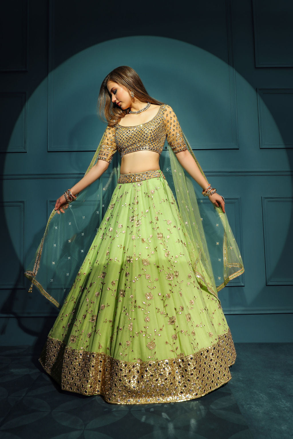 Golden blouse with green skirt