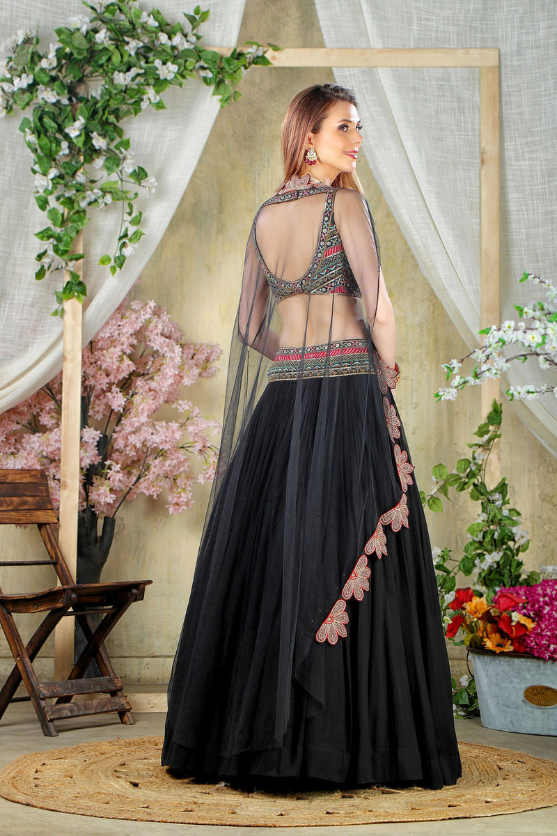 Black embroidered top with matching skirt and cape