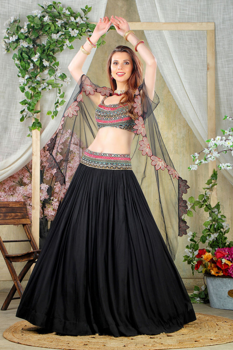 Black embroidered top with matching skirt and cape