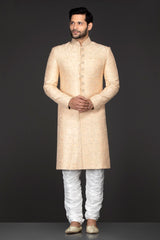 Peach Brocade Sherwani With Embroidery Buttons Paired With White Trousers