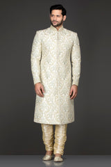 Ivory Colour Silk Sherwani With Silver Zari And Dori Embroidery Paired With Gold Bottoms