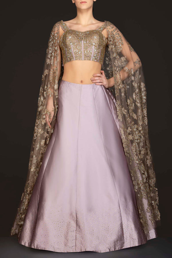 Mauve Colour Silk Skirt With Heavily Embriodered Net Top And Attached Net Cape